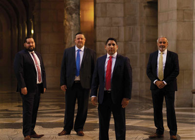 Photo of attorneys: David V. Chipman, Carlos A. Monzón, Raul F. Guerra and Sean M. James